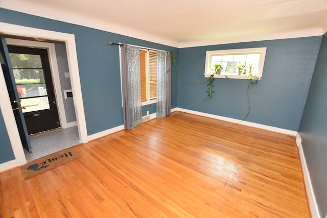 spare room featuring light hardwood / wood-style flooring