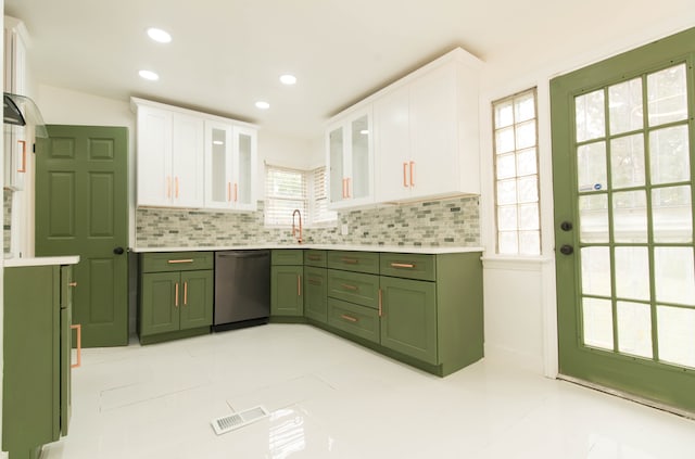 kitchen with white cabinetry, stainless steel dishwasher, green cabinets, and sink