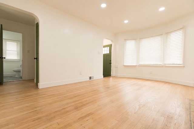 spare room with light wood-type flooring