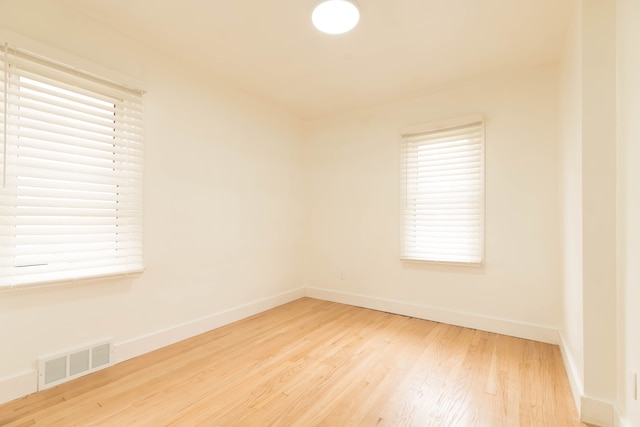 empty room with light hardwood / wood-style floors