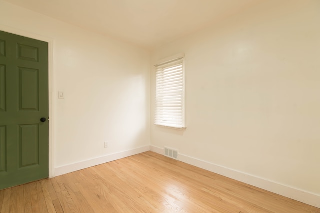 unfurnished room featuring light wood-type flooring