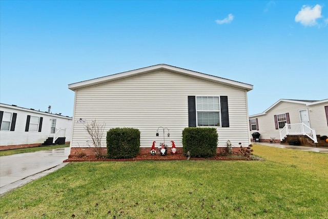 view of property exterior featuring a lawn