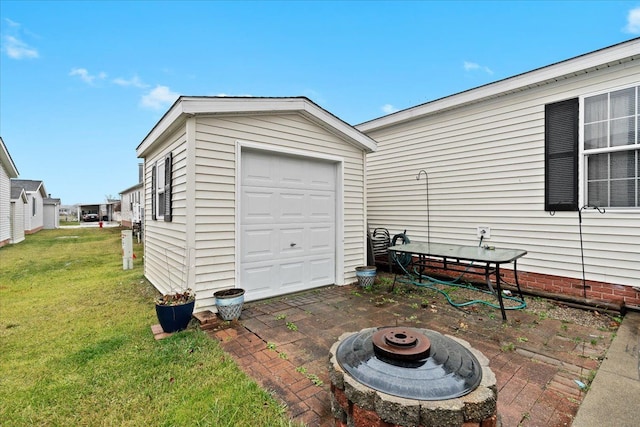 garage featuring a lawn