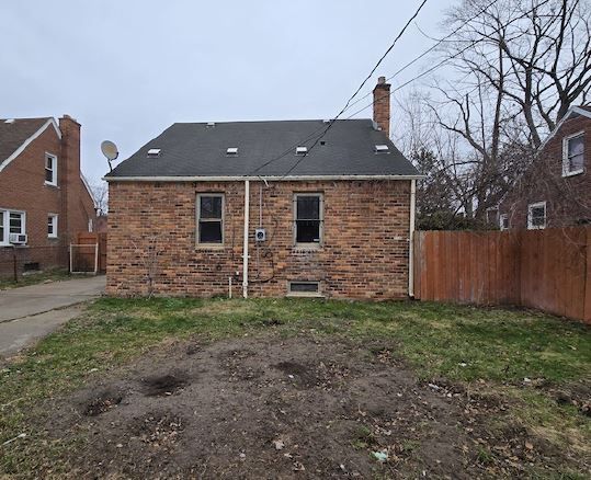 rear view of house featuring cooling unit