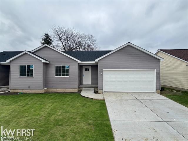 single story home with a garage and a front lawn