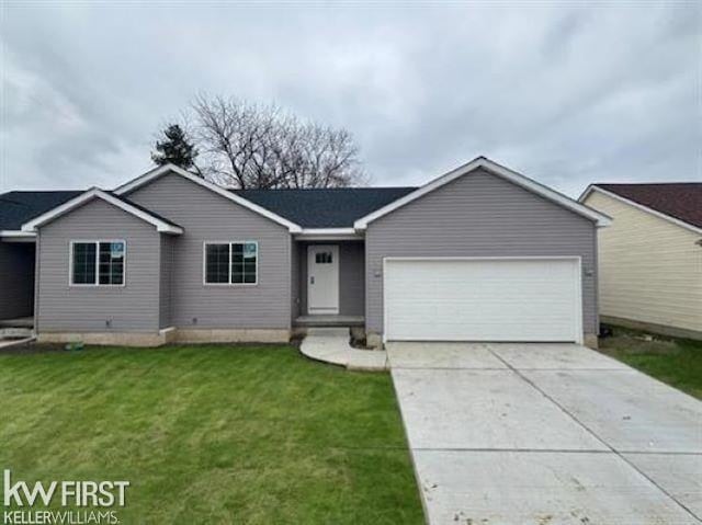 ranch-style home with a garage and a front yard