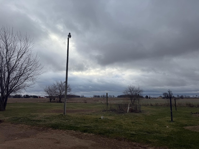 view of yard with a rural view