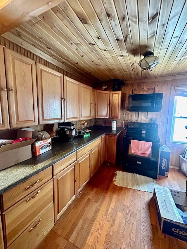 kitchen featuring black range with electric stovetop, wood-type flooring, and wooden ceiling