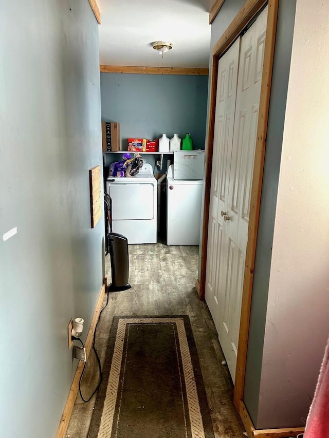 corridor with wood-type flooring and washer and clothes dryer