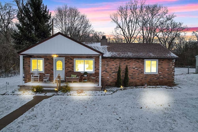 ranch-style home with covered porch