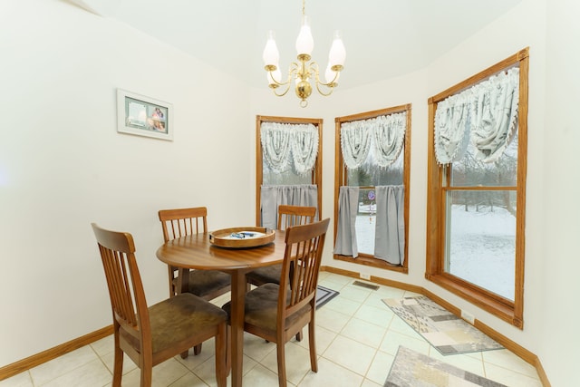 tiled dining space with a notable chandelier