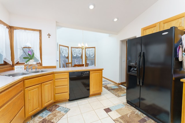 kitchen with vaulted ceiling, black appliances, light tile patterned floors, sink, and an inviting chandelier