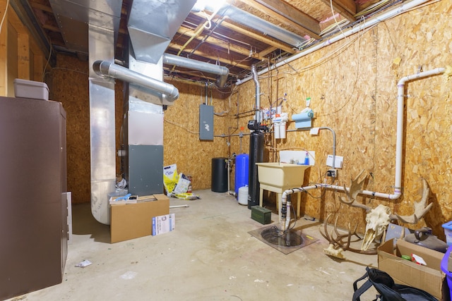 basement with heating unit and electric panel