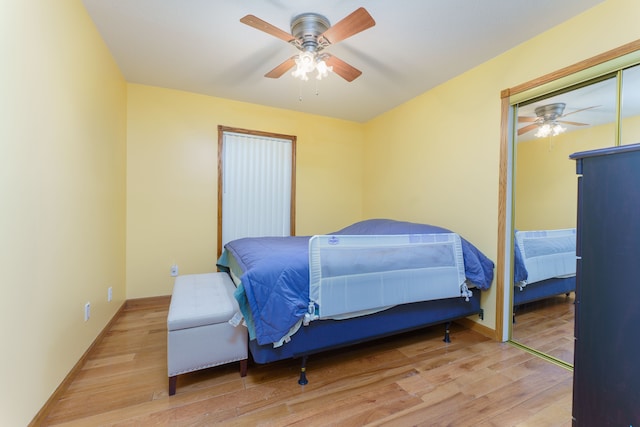 bedroom with ceiling fan and light wood-type flooring