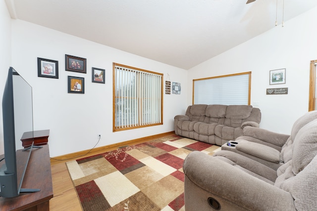 living room featuring hardwood / wood-style floors and vaulted ceiling