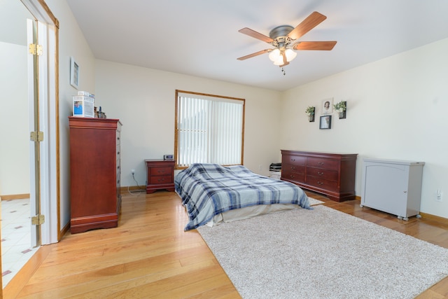 bedroom with hardwood / wood-style flooring and ceiling fan