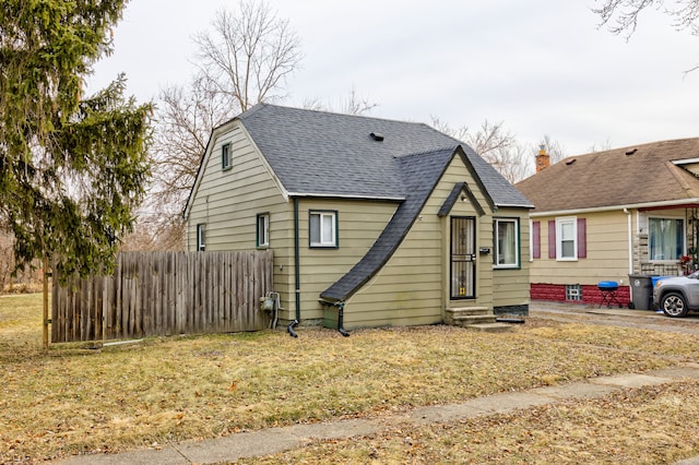 bungalow-style house with a front yard