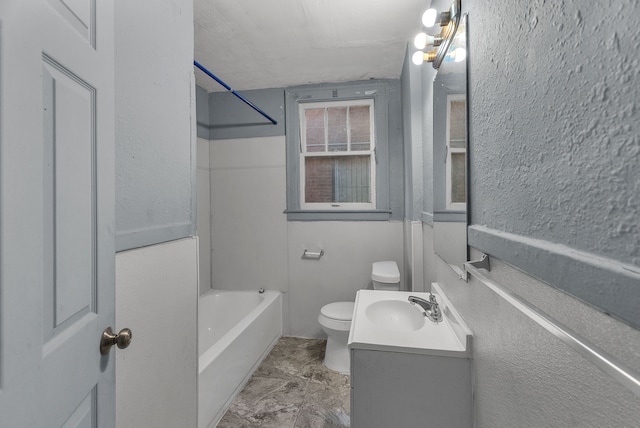 full bathroom featuring vanity, toilet, and  shower combination