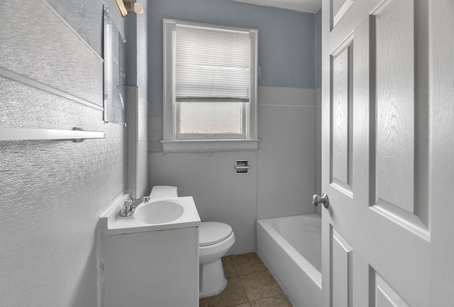 bathroom with tile patterned floors, vanity, and toilet