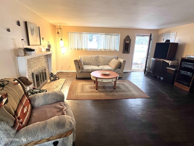 living room with a fireplace and wood-type flooring