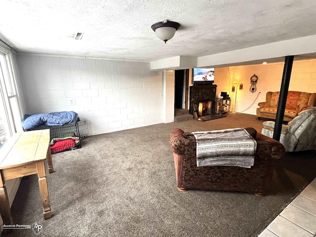 living room featuring carpet floors and a textured ceiling