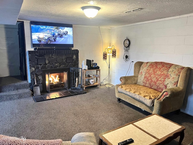 living room with a stone fireplace, carpet flooring, and a textured ceiling