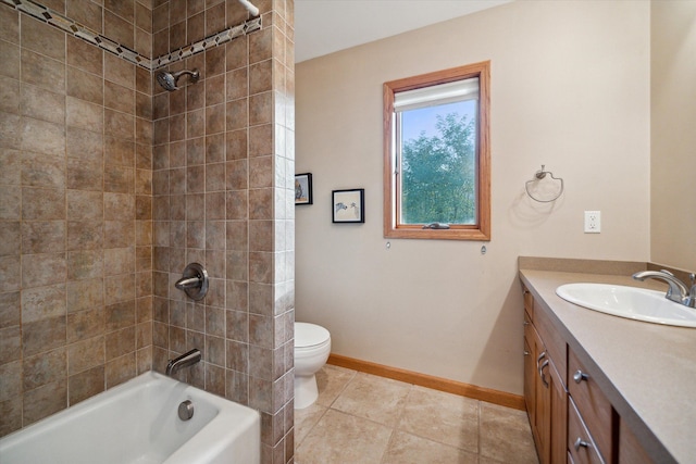 full bathroom featuring tile patterned floors, toilet, vanity, and tiled shower / bath