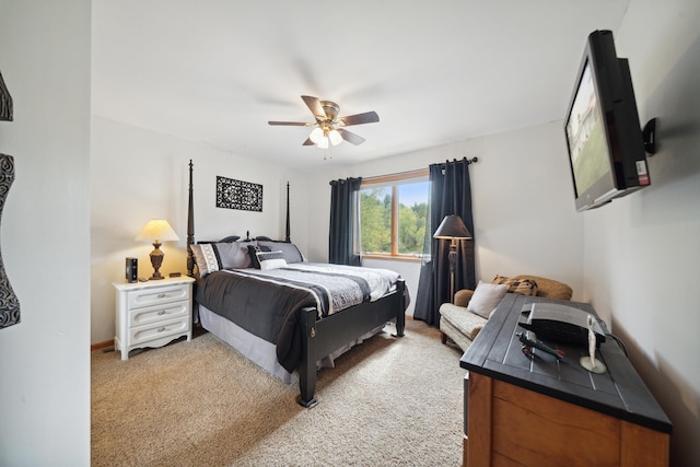 bedroom featuring ceiling fan and light carpet