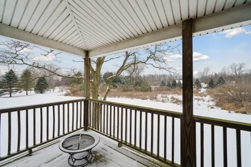 view of snow covered deck