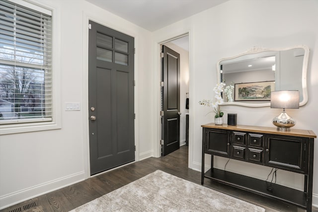 foyer with dark hardwood / wood-style floors