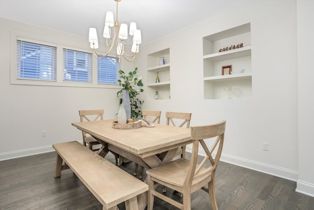 dining space featuring a chandelier, dark hardwood / wood-style floors, and built in features