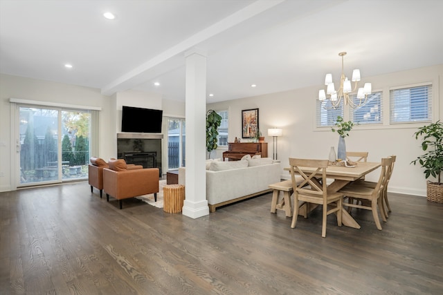 dining space featuring a chandelier, beamed ceiling, and dark wood-type flooring