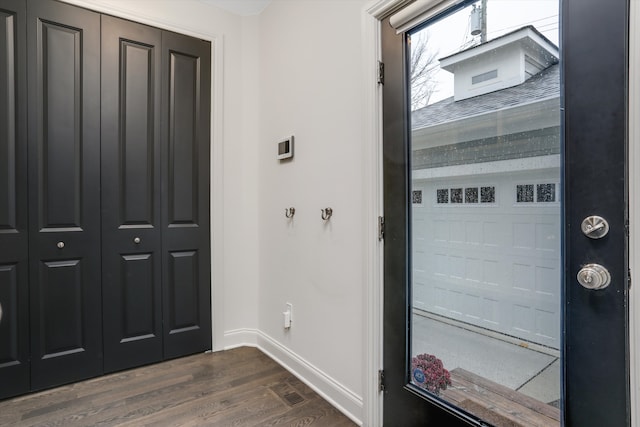 entrance foyer with dark hardwood / wood-style floors