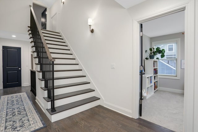 stairway featuring hardwood / wood-style flooring