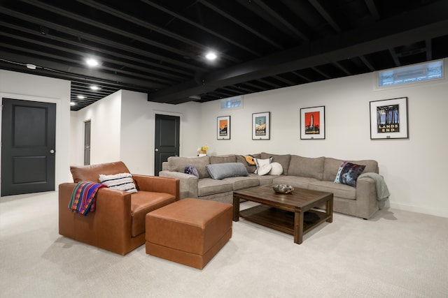 living room featuring beam ceiling and light colored carpet