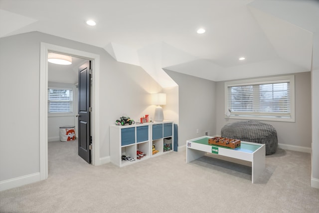 game room with light carpet and lofted ceiling