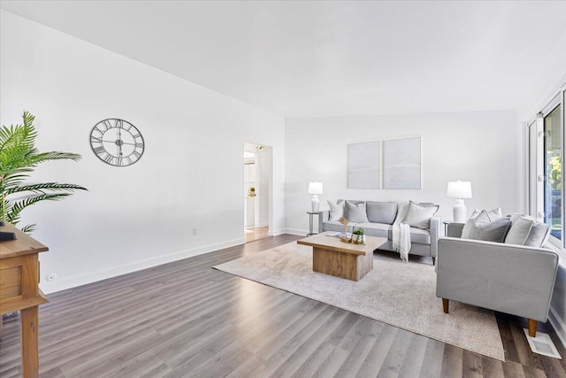 living room with dark wood-type flooring