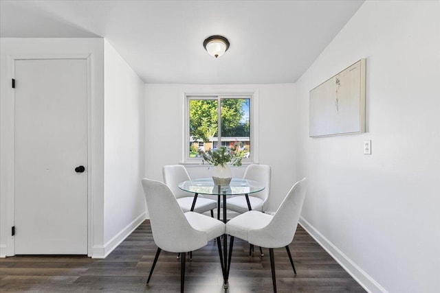 dining room featuring dark hardwood / wood-style flooring