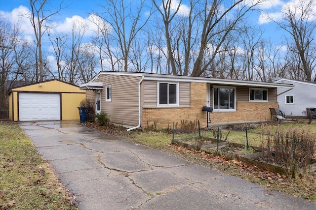 view of front of property featuring a garage and an outbuilding