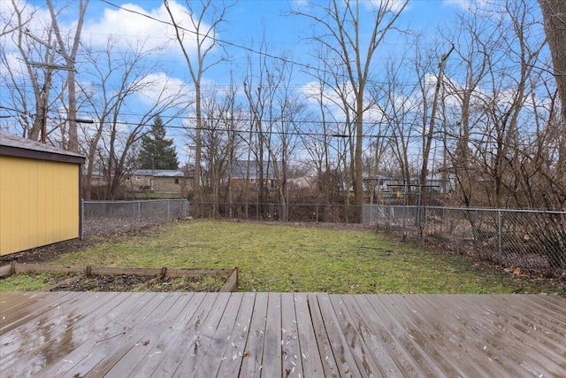 wooden terrace with a lawn