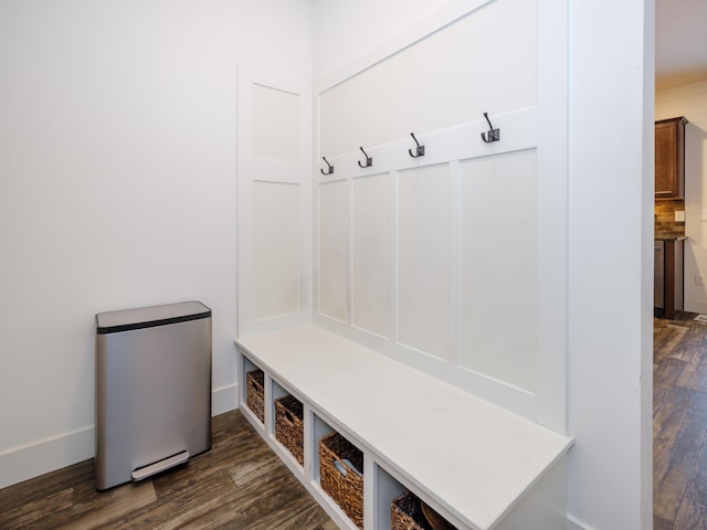 mudroom featuring dark wood-style flooring and baseboards