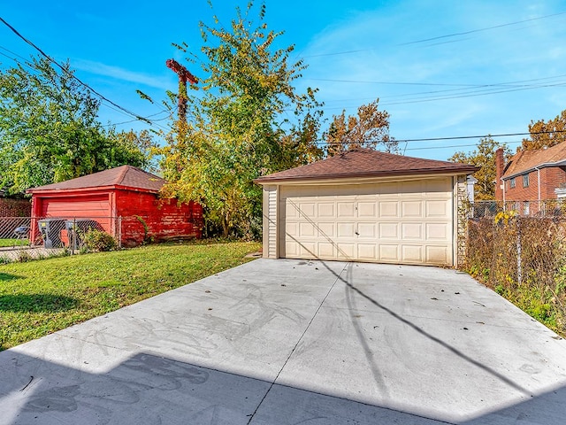 garage featuring a lawn