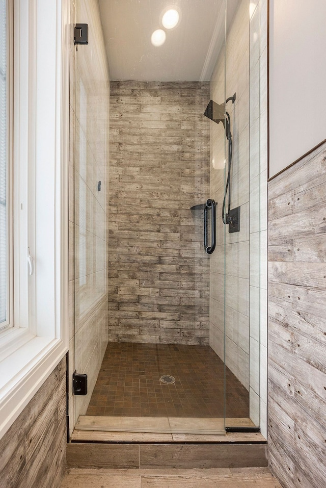 bathroom with a shower with shower door