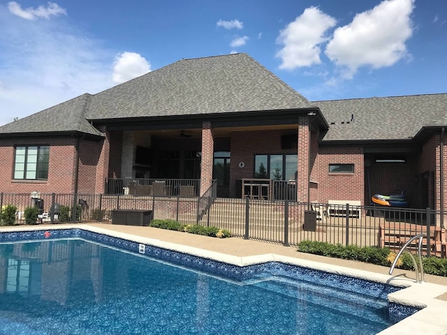 view of swimming pool featuring ceiling fan