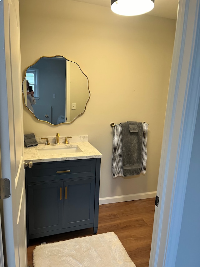 bathroom featuring vanity and wood-type flooring