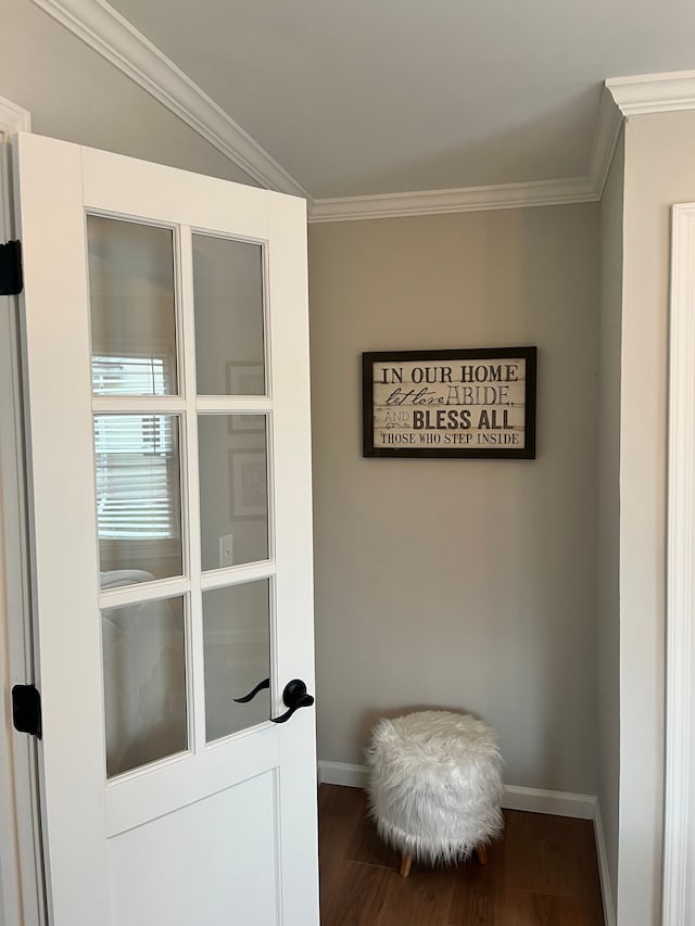 interior space featuring hardwood / wood-style flooring and ornamental molding