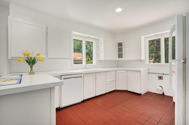 kitchen featuring white cabinetry, white appliances, and sink