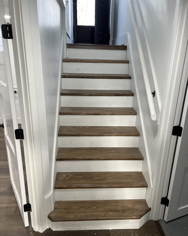 stairway featuring hardwood / wood-style flooring