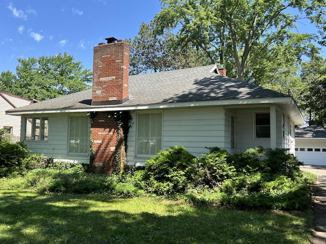 rear view of property with a yard