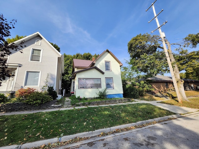 view of property featuring a front yard